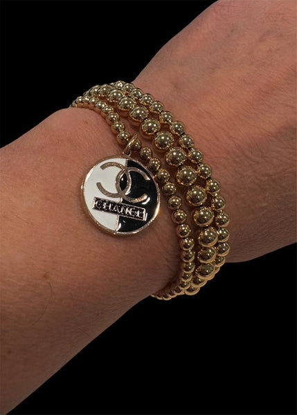 Gold Tone Stretch Bracelet - CC Black Logo